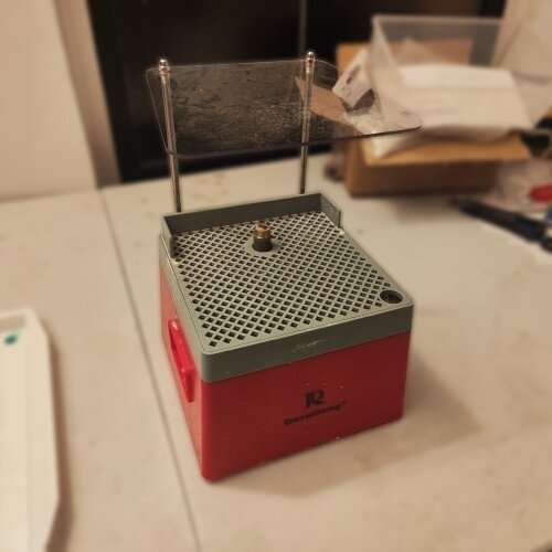 Stained glass grinder with diamond bit and water reservoir — an essential tool in this stained glass tools guide